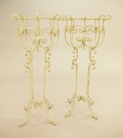 Appraisal: Pair of Mediterranean-Style Polychromed Wrought-Iron Openwork Jardiniere Stands the circular