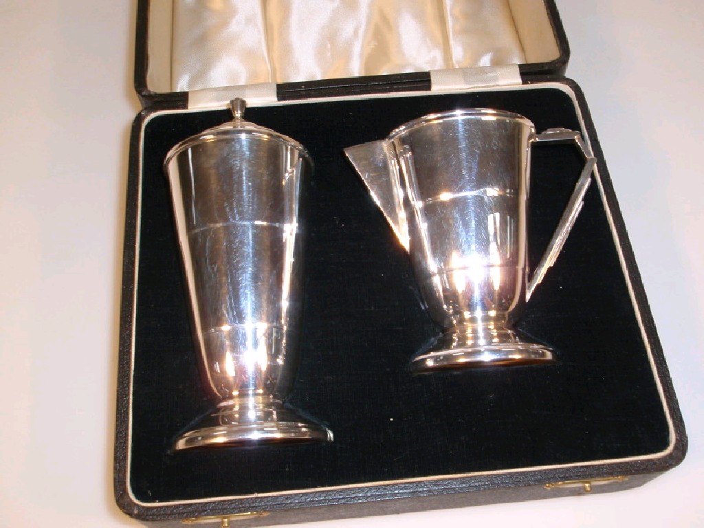 Appraisal: A George V silver castor and cream jug by Joseph