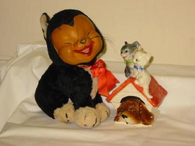 Appraisal: A Merrythought seated cat soft toy with moulded rubber Happy