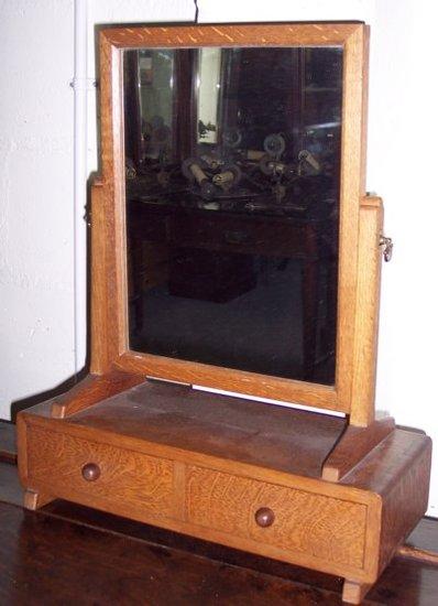 Appraisal: An oak swing frame toilet mirror with rectangular plate the