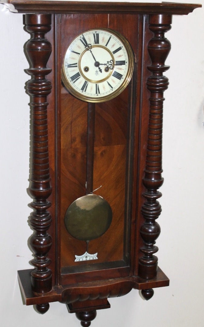 Appraisal: A late thC walnut cased Vienna wall clock by Gustav