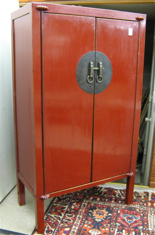 Appraisal: MING STYLE TWO-DOOR CABINET Chinese th century with overall red