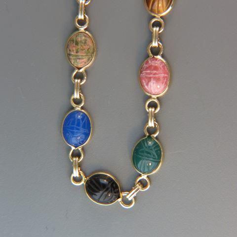 Appraisal: k Gold Scarab Necklace various carved gems x mm each