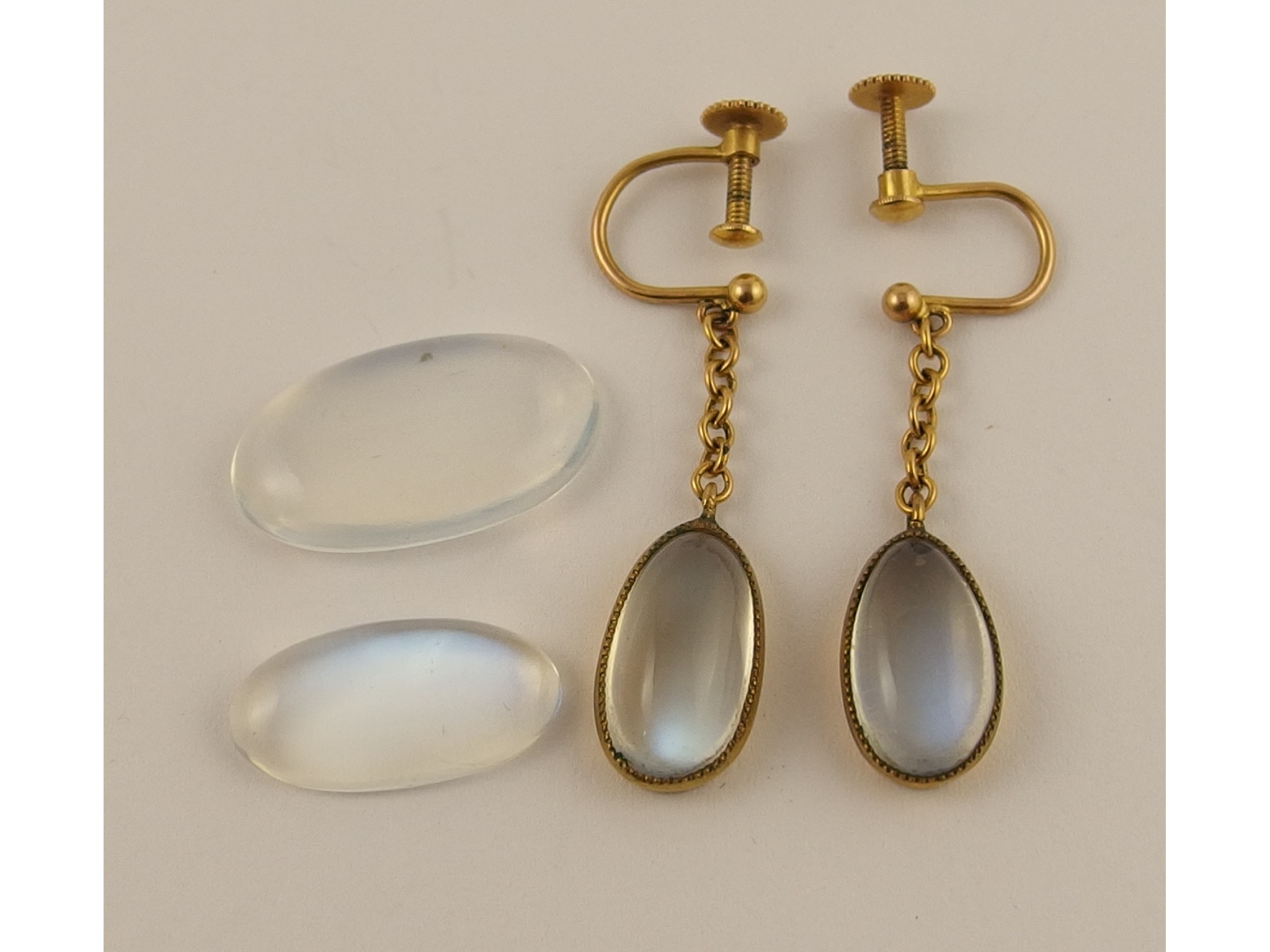 Appraisal: A pair of yellow metal set moonstone earrings and two