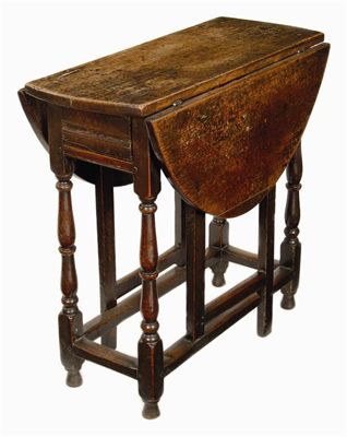 Appraisal: An early th century oak gateleg table the oval drop-leaf