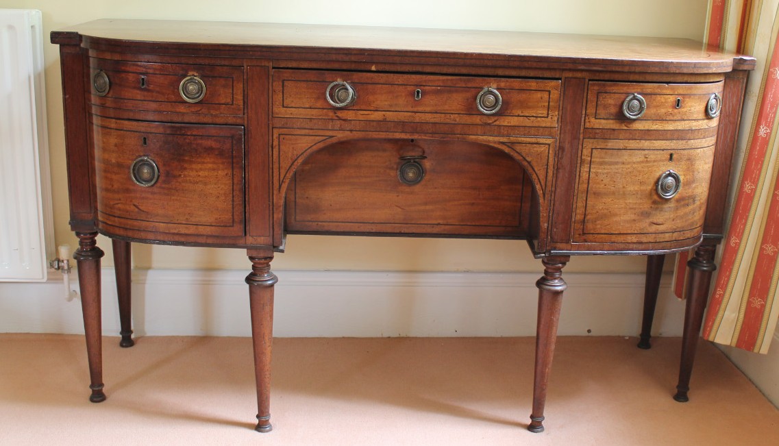 Appraisal: A George III mahogany bow front sideboard with ebony strung