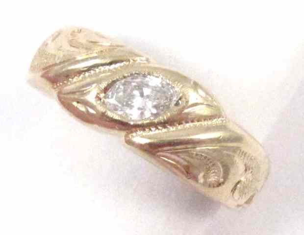 Appraisal: MAN'S DIAMOND AND YELLOW GOLD RING The k gold band