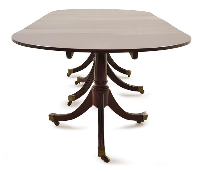 Appraisal: A REGENCY STYLE MAHOGANY TRIPLE PEDESTAL D-END DINING TABLE the