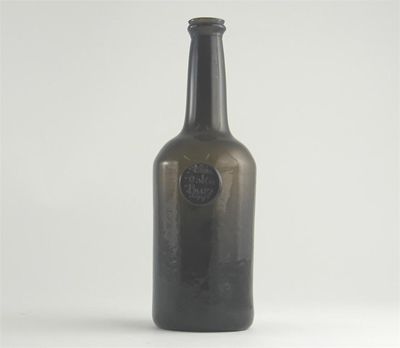 Appraisal: A dated olive green glass wine bottle the shoulder applied