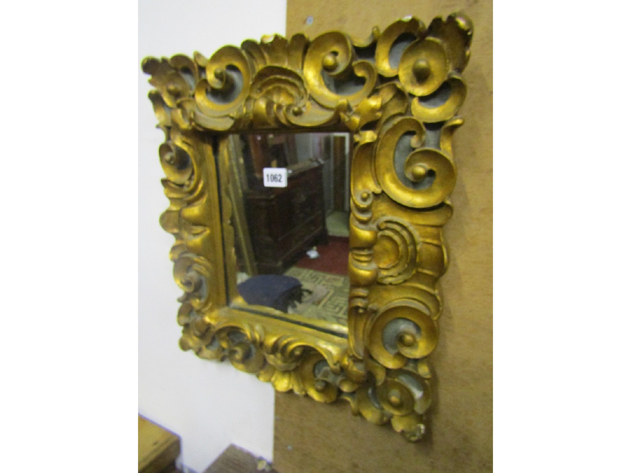 Appraisal: A small contemporary wall mirror the rectangular plate set within