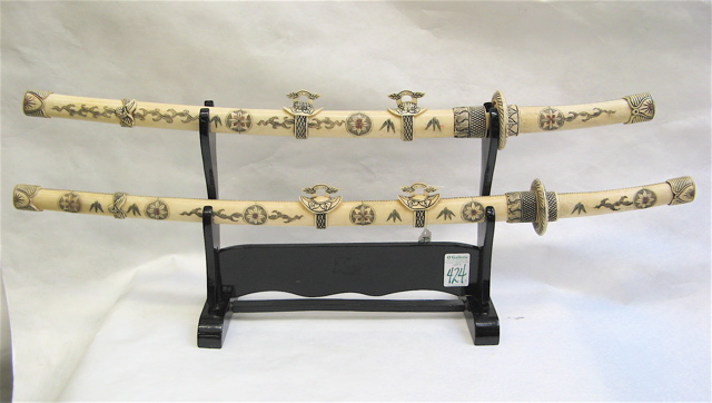 Appraisal: TWO CHINESE PIECED BONE SWORDS WOOD STAND pieces The Samurai