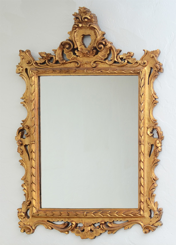 Appraisal: ROCOCO STYLE GILT WALL MIRROR Contemporary composite material overall measures