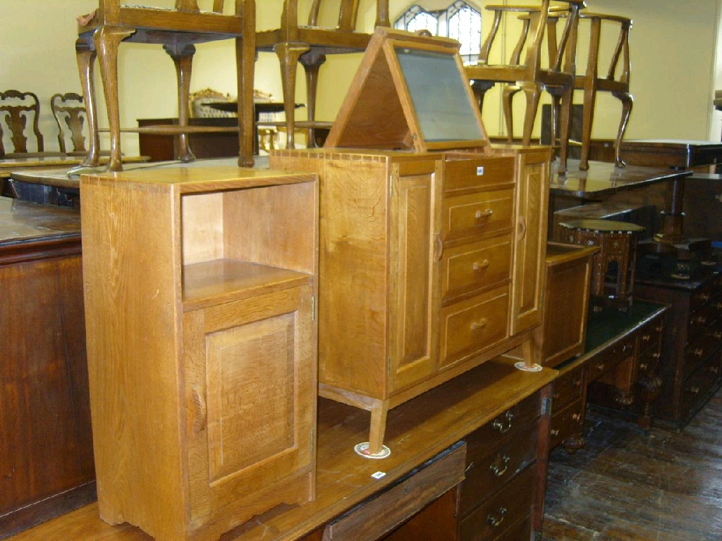 Appraisal: A Cotswold School style oak dressing table fitted with long