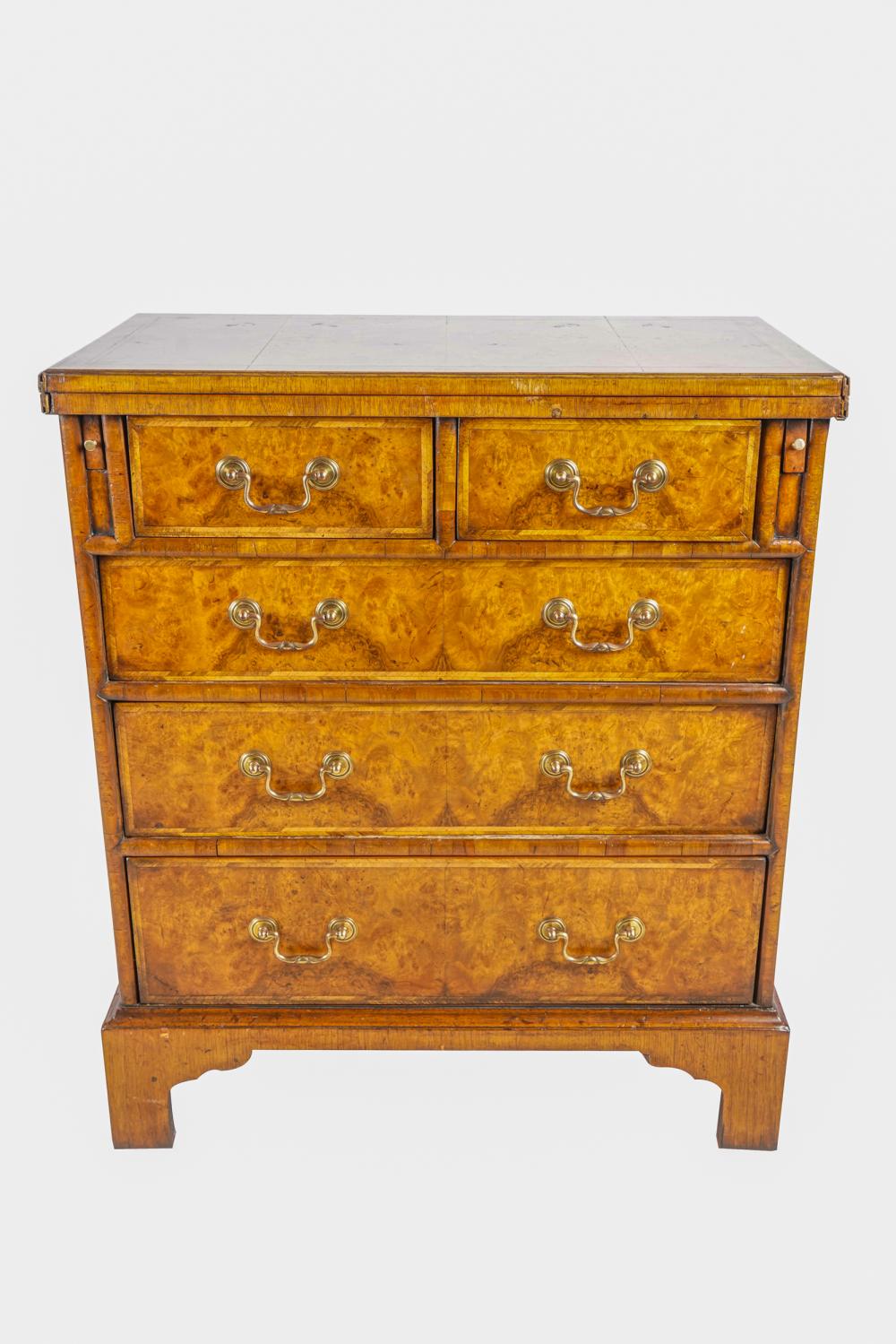 Appraisal: GEORGIAN WALNUT BACHELOR'S CHESTwith hinged folding top over a pair