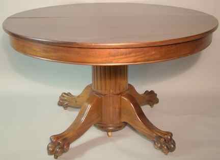 Appraisal: AMERICAN CLASSICAL MAHOGANY CIRCULAR DINING TABLE WITH TWO LEAVES the