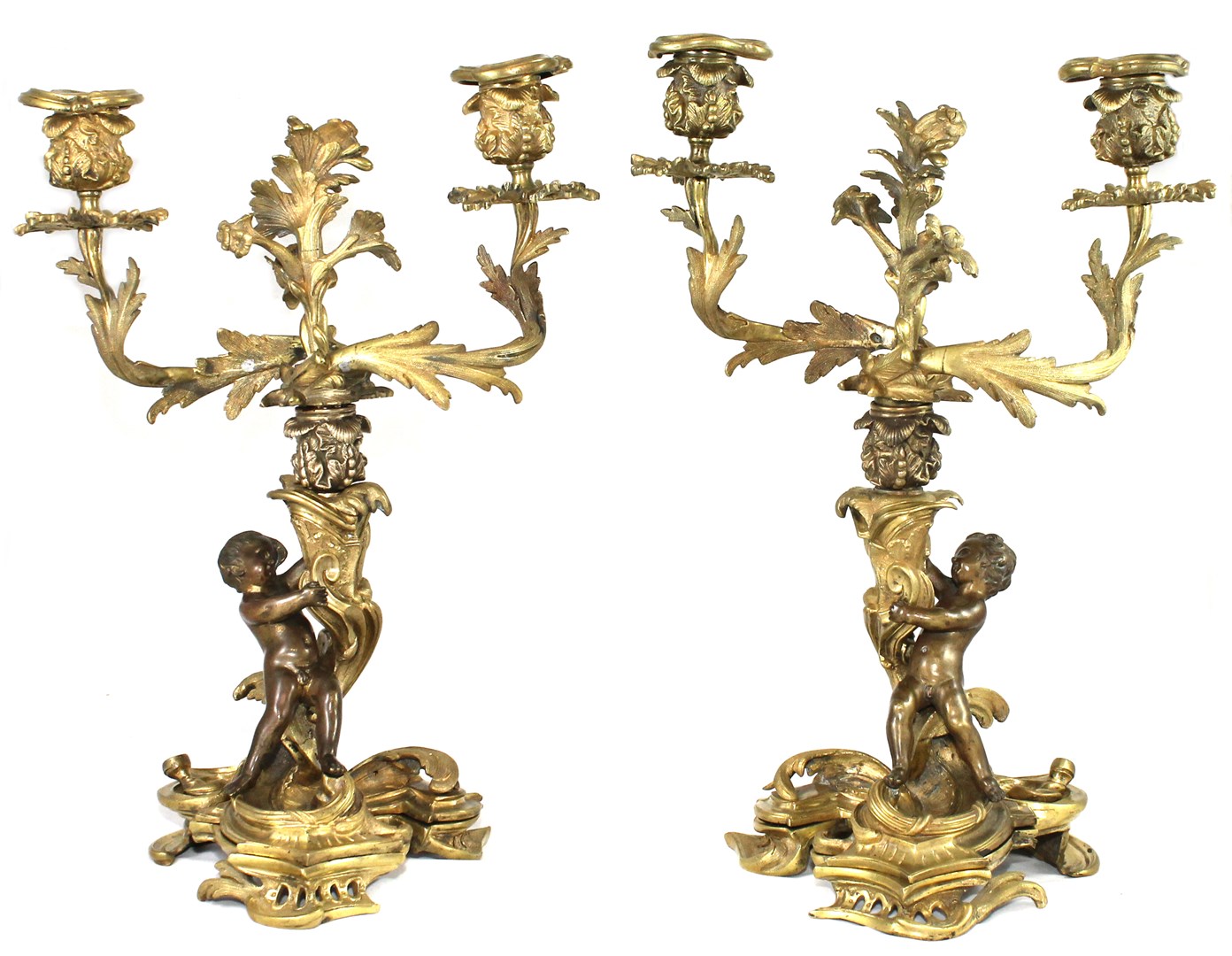 Appraisal: A pair of French gilt and patinated bronze twin light