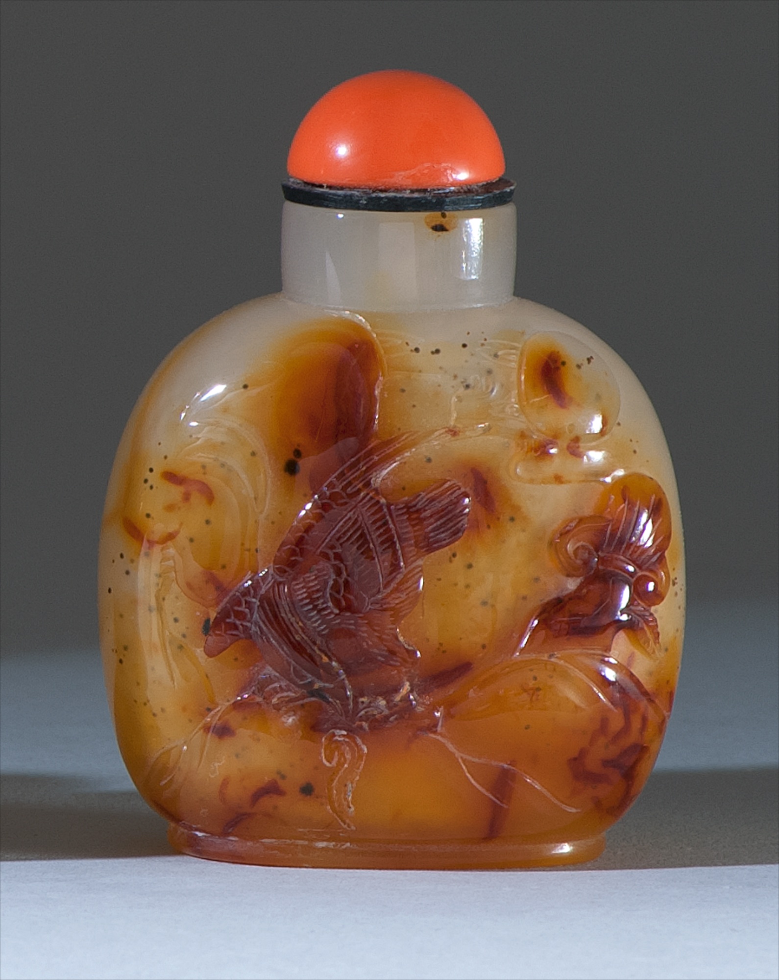 Appraisal: FLOATER AGATE SNUFF BOTTLE Circa In ovoid form With hawk