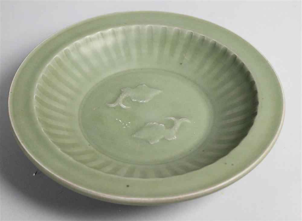 Appraisal: CHINESE MING CARVED CELADON DISH of typical form carved with