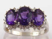 Appraisal: A carat white gold three stone amethyst ring with diamond