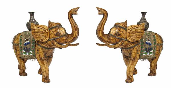 Appraisal: A pair of Chinese carved bone veneer figures on elephants