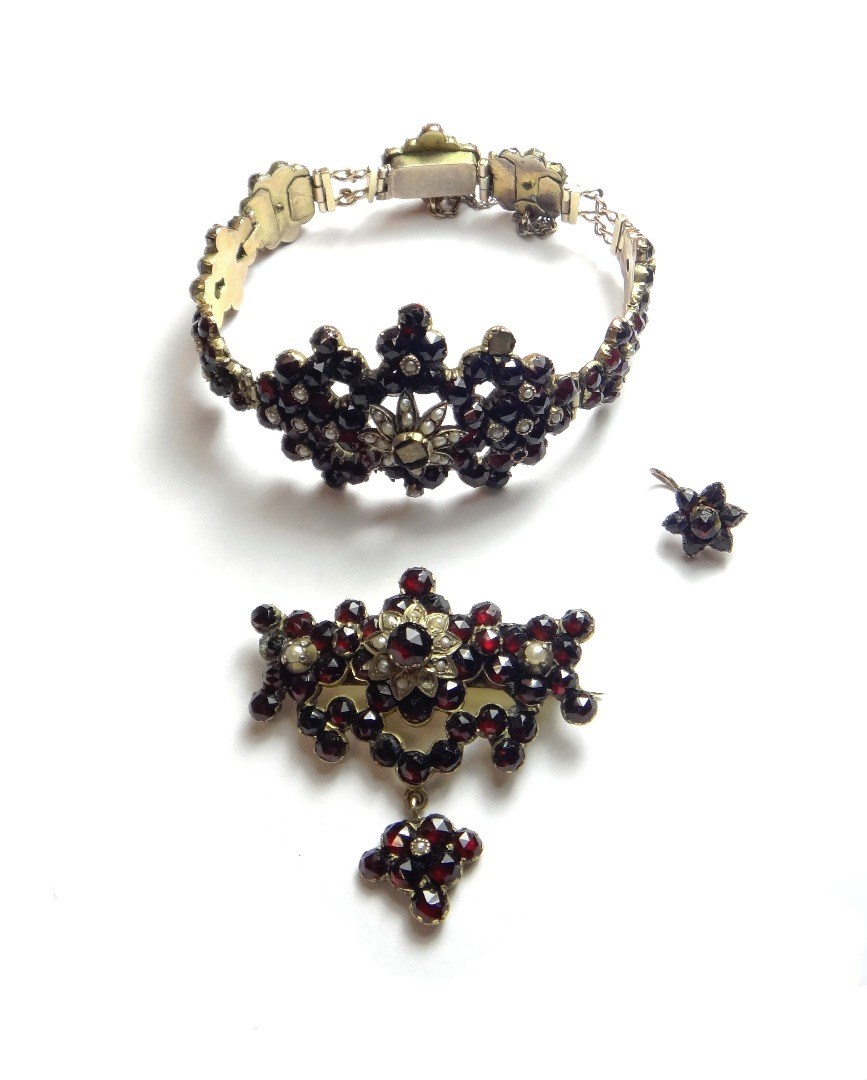 Appraisal: A Bohemian garnet and seed pearl set bracelet on a