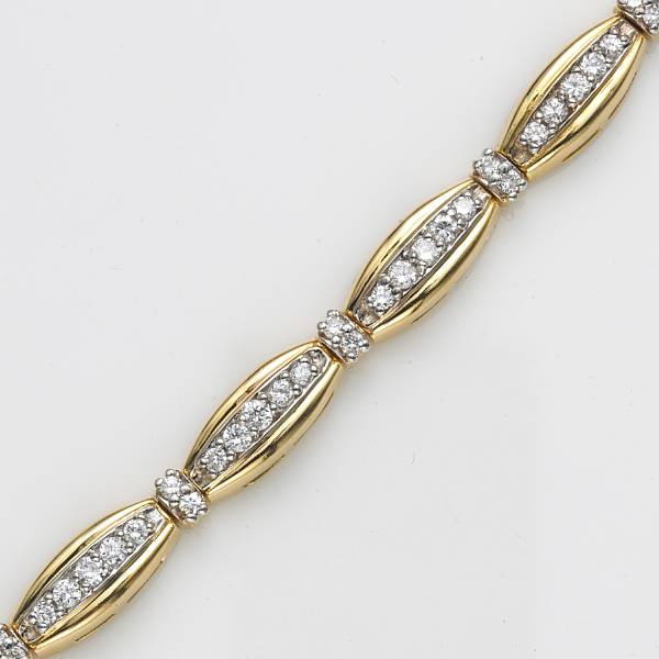 Appraisal: A diamond and eighteen karat gold navette link tennis bracelet