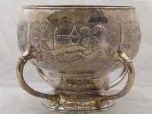 Appraisal: A four handled white metal tests silver Indian bowl embossed