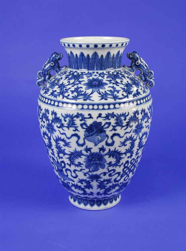 Appraisal: CHINESE BLUE AND WHITE VASE Qing Dynasty with foo dog