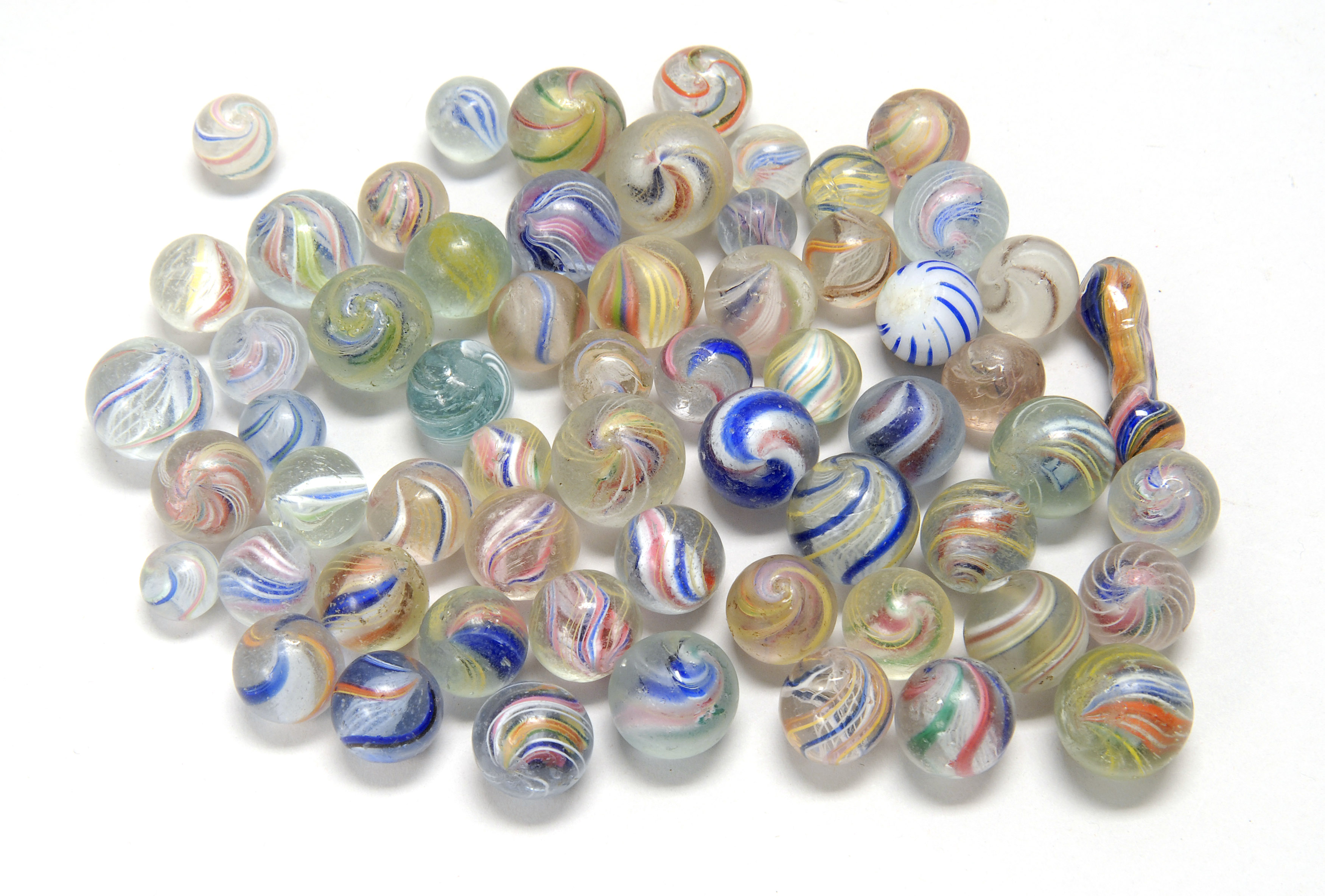 Appraisal: APPROXIMATELY SIXTY SWIRL GLASS MARBLES ConditionSome wear