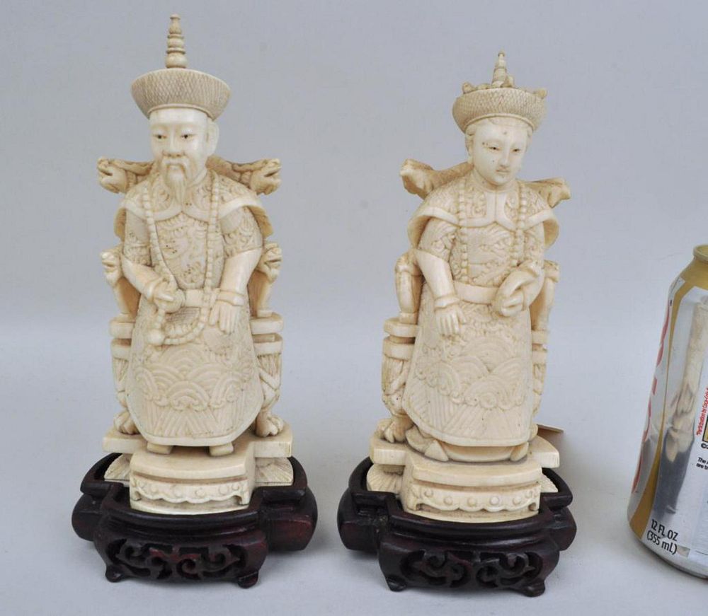 Appraisal: Pair Chinese Carved Seated Emperor Empress each figure on dragon