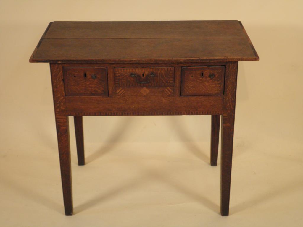 Appraisal: An thC oak lowboy the cross banded top above three