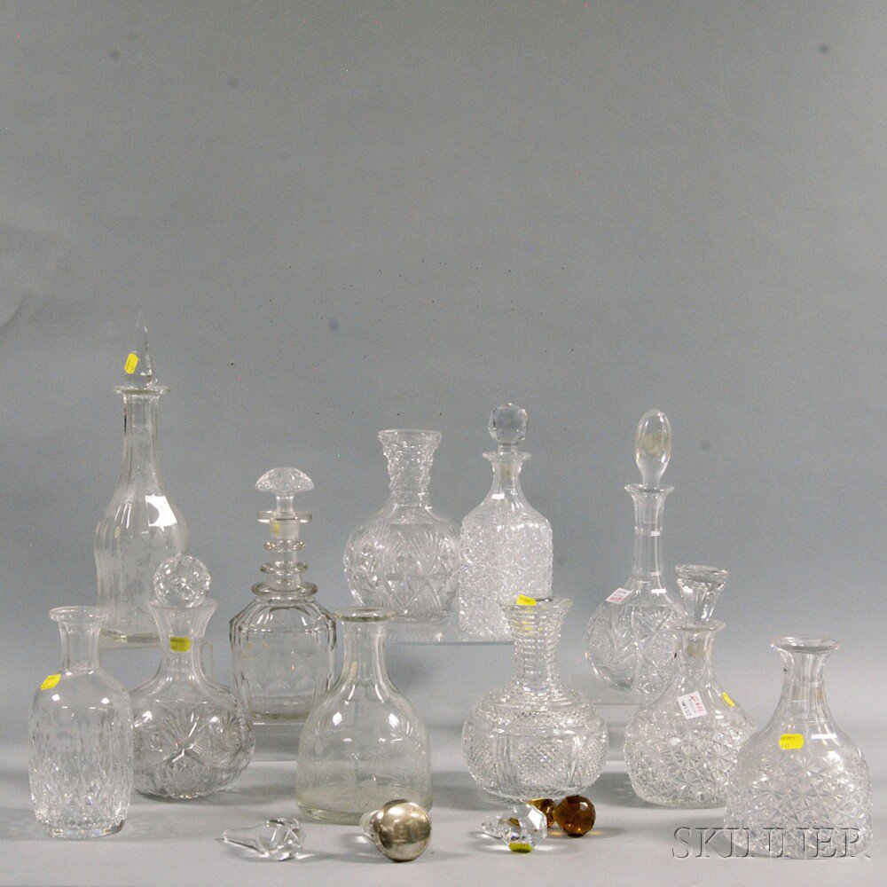 Appraisal: Eleven Decanters and Ten Miscellaneous Stoppers including one with buzzstars