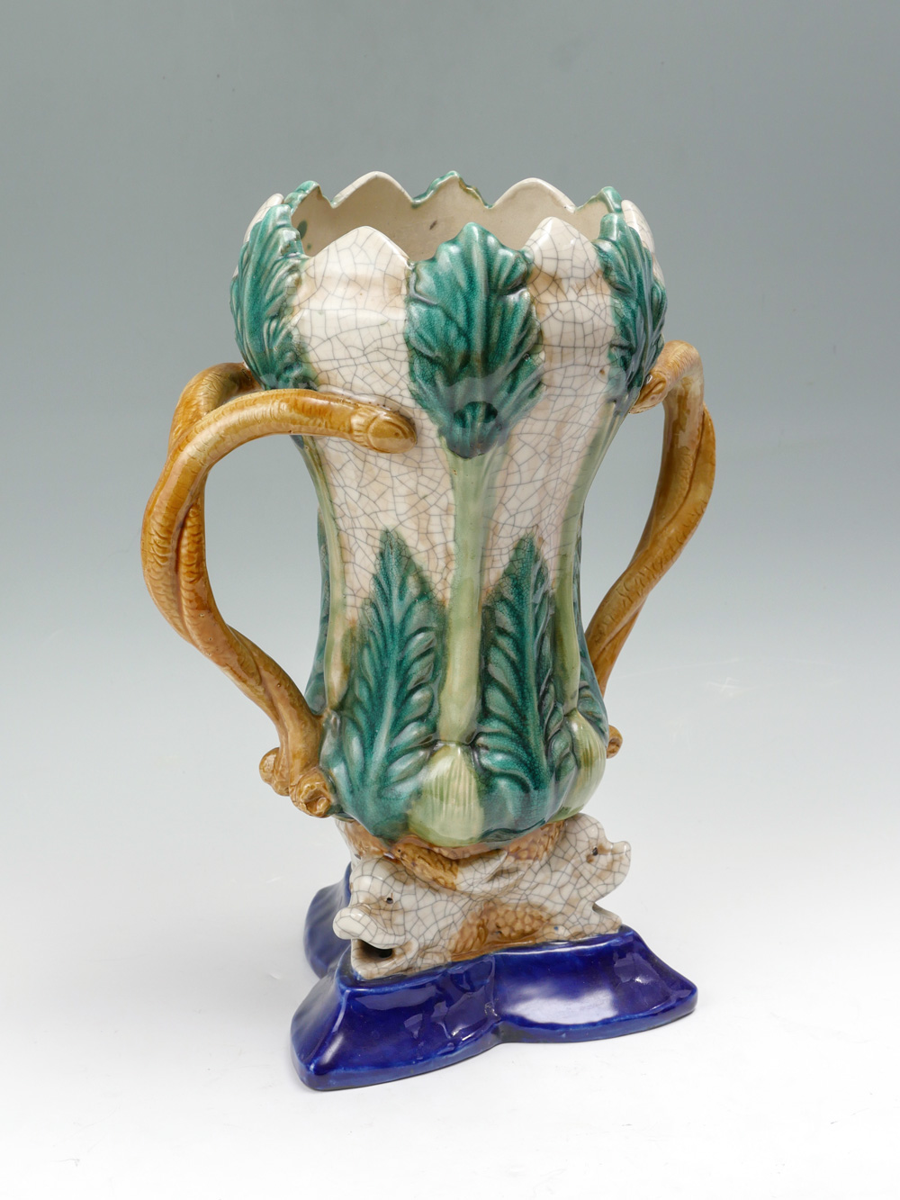 Appraisal: LARGE MAJOLICA FOLIATE DOUBLE HANDLED VASE Large majolica foliate vase