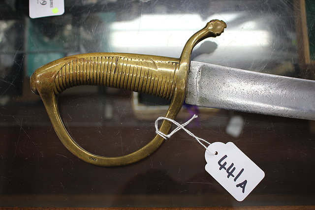 Appraisal: A TH CENTURY ENGLISH CAVALRY SWORD with a brass grip