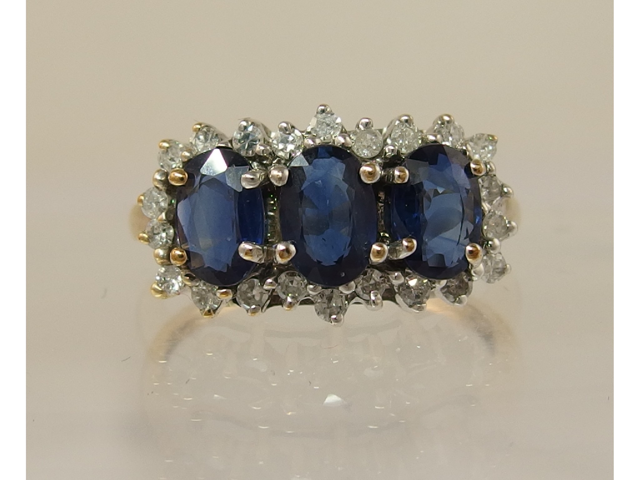 Appraisal: A ct diamond and blue gem stone ringin un-hallmarked yellow