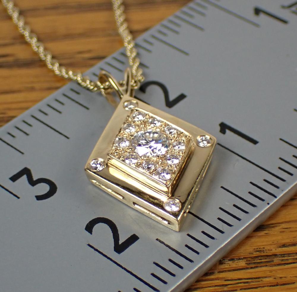 Appraisal: DIAMOND AND FOURTEEN KARAT GOLD PENDANT NECKLACE with an k