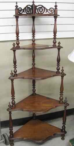 Appraisal: A VICTORIAN WALNUT WHAT-NOT STAND American c a -tier design