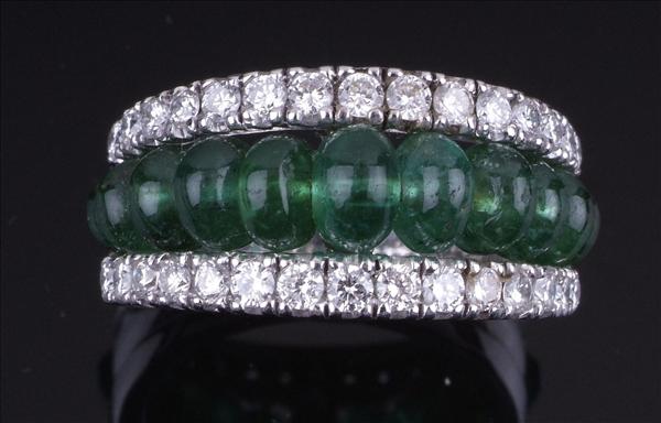 Appraisal: An emerald and diamond dress ring the centre set with