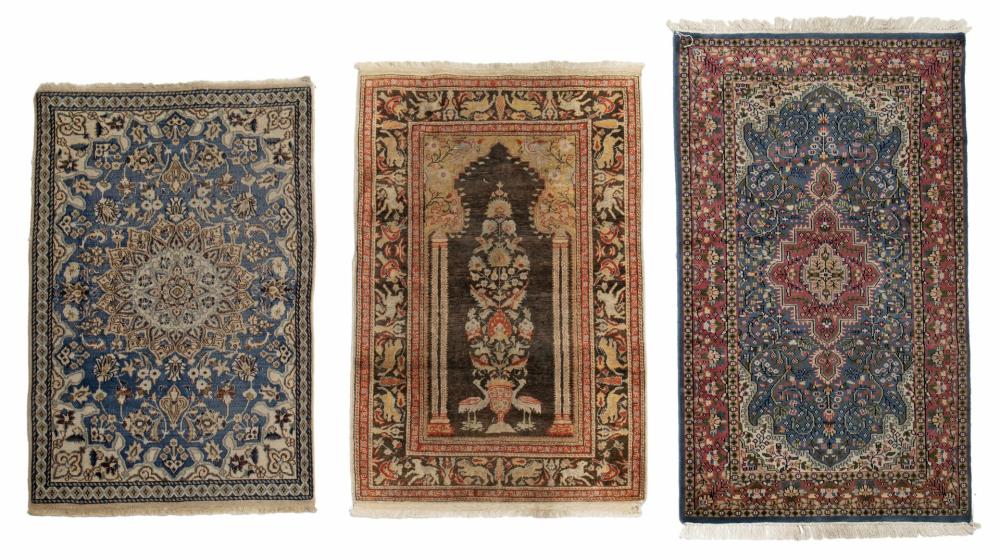 Appraisal: Three Persian-style rugs th Century Comprising one wool on cotton