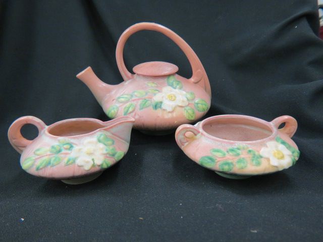 Appraisal: Roseville Pottery White Rose Tea Set pink teapot is tall