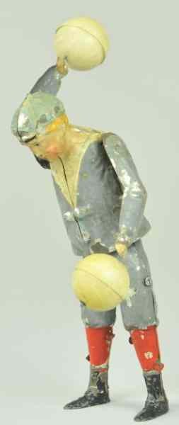 Appraisal: BOY TWIRLING BALLS Germany hand painted tin full figure of