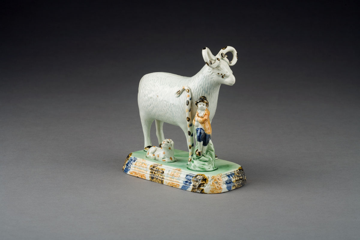 Appraisal: ENGLISH PEARLWARE SHEPHERD FIGURAL GROUP CIRCA - Modelled as a