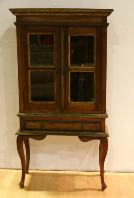 Appraisal: A Continental pine display cabinet on stand with cabriole legs