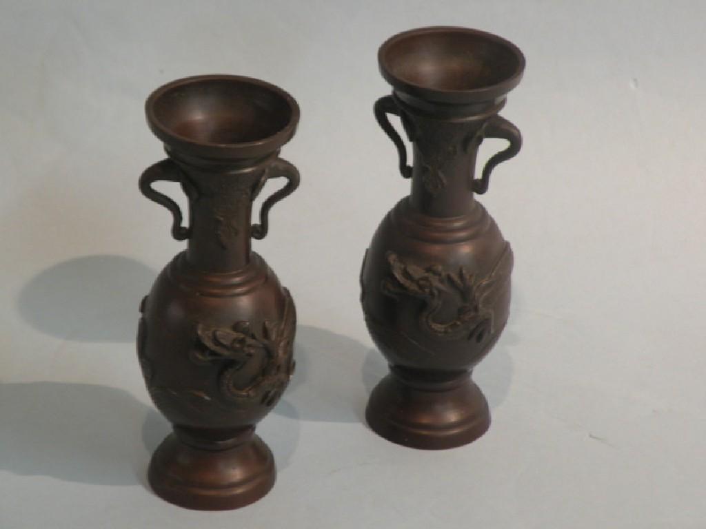 Appraisal: A pair of Chinese bronze two handled baluster shaped vases