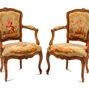 Appraisal: A Pair of Louis XV Tapestry-Upholstered Walnut Fauteuils th Century