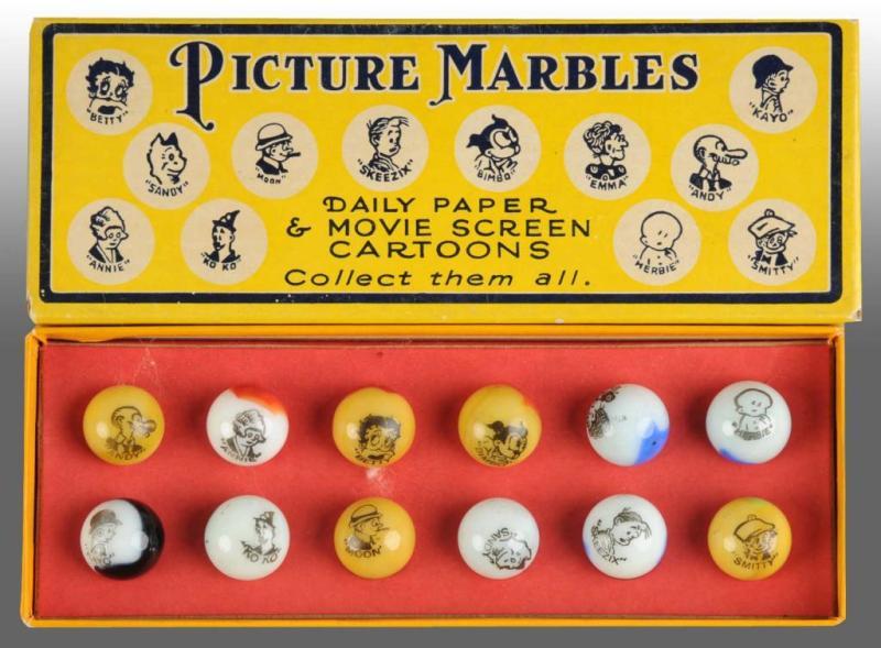 Appraisal: Peltier Comic Marble Box Set Description count comic marbles Box