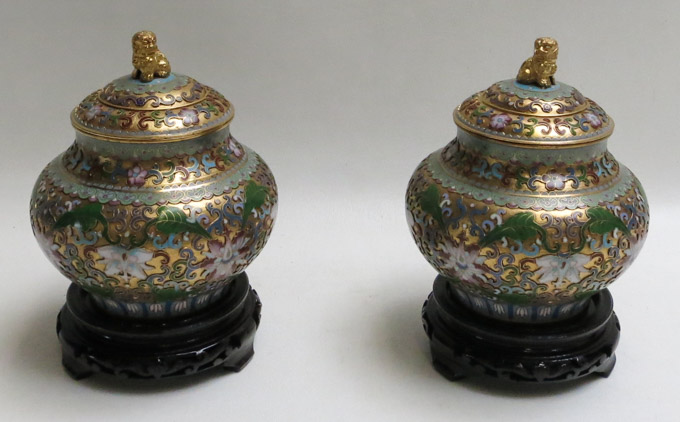 Appraisal: A PAIR OF CHINESE OPENWORK CLOISONNE COVERED JARS with colorful