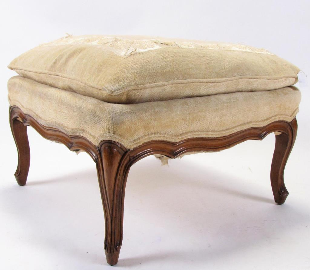 Appraisal: An antique French provincial walnut footstool with padded pillow upholstery