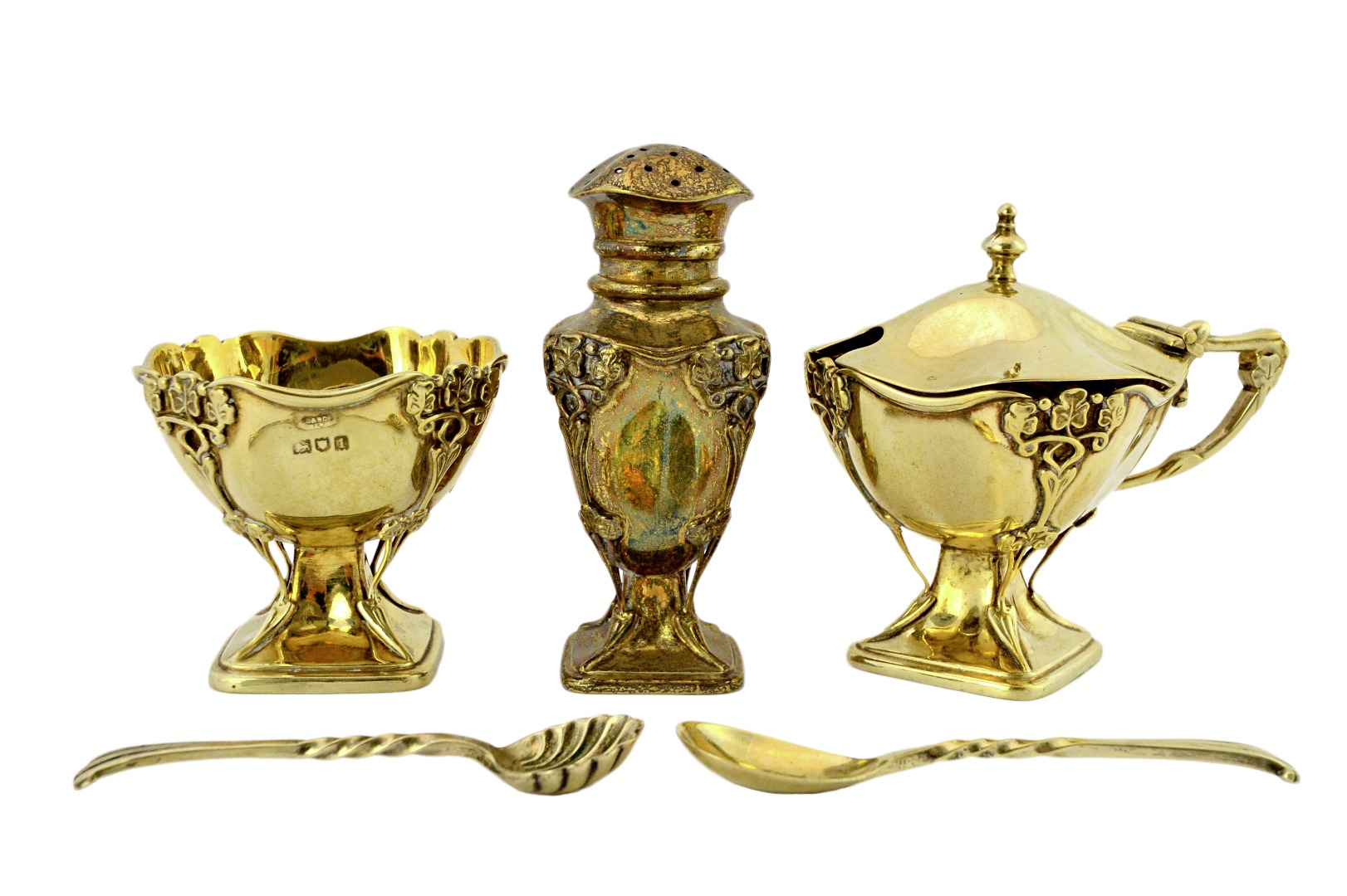 Appraisal: A silver gilt eight piece condiment set comprising two mustard