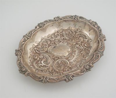 Appraisal: A late Victorian embossed oval dish with a tusk and